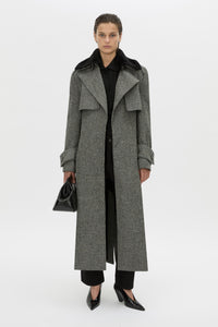 Front-styled-2 view CAMILLA AND MARC Chime long-sleeve merino wool knit polo top in black.