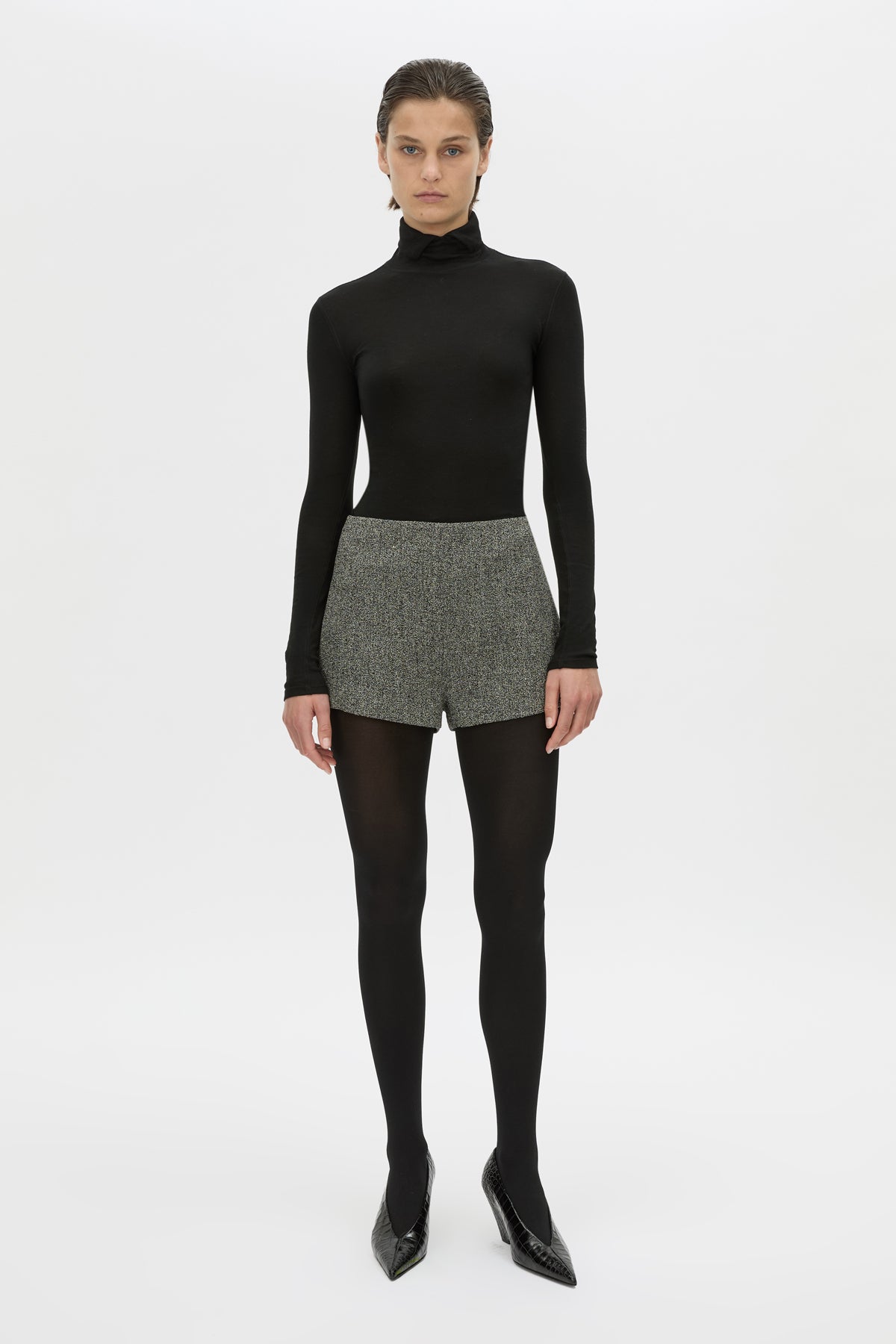 Front styled view CAMILLA AND MARC high waisted Cinder Mini Short in charcoal grey with invisible side seam closure.