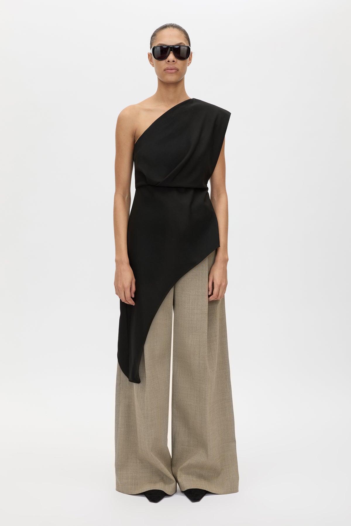 Front view CAMILLA AND MARC Ciran Asymmetric Top in Black styled with the Halden Pant.