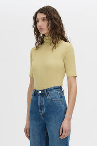 Cropped view CAMILLA AND MARC Dakota slim fit lemongrass top with ribbed turtle neck.