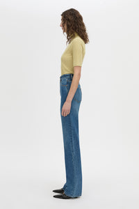 Side view CAMILLA AND MARC Dakota slim fit lemongrass top with ribbed turtle neck.