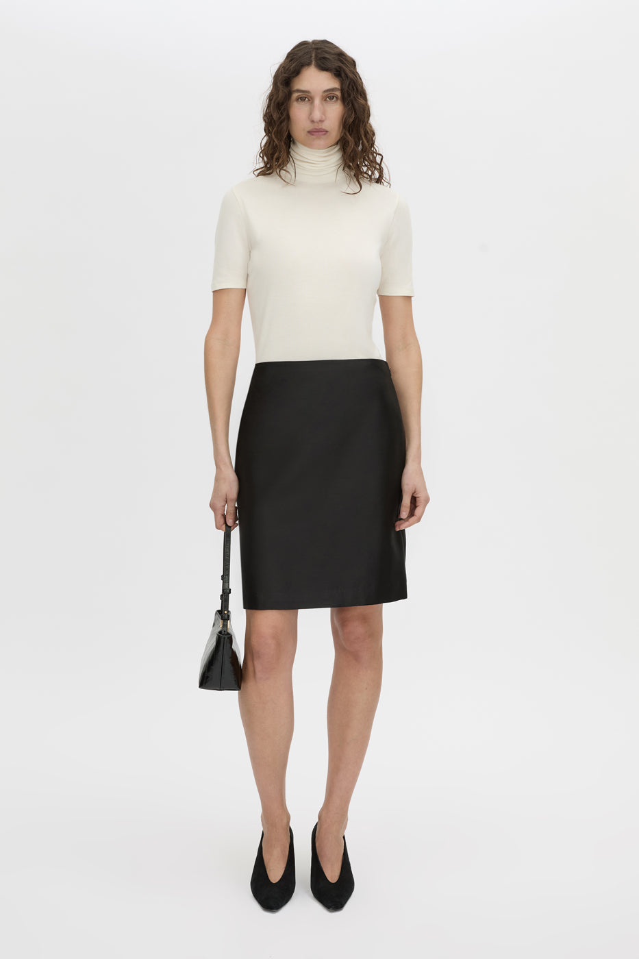 Front-styled view CAMILLA AND MARC Dakota slim fit cream top with ribbed turtle neck.
