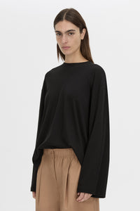 Cropped view CAMILLA AND MARC Dakota long sleeve top in black.
