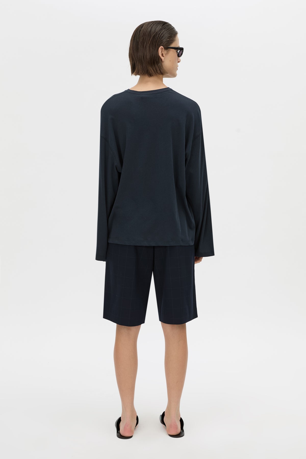Back view CAMILLA AND MARC Dakota long sleeve top in navy.