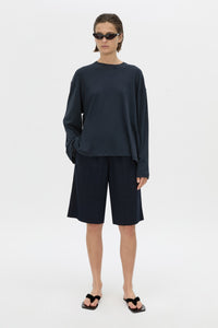 Front-styled view CAMILLA AND MARC Dakota long sleeve top in navy.