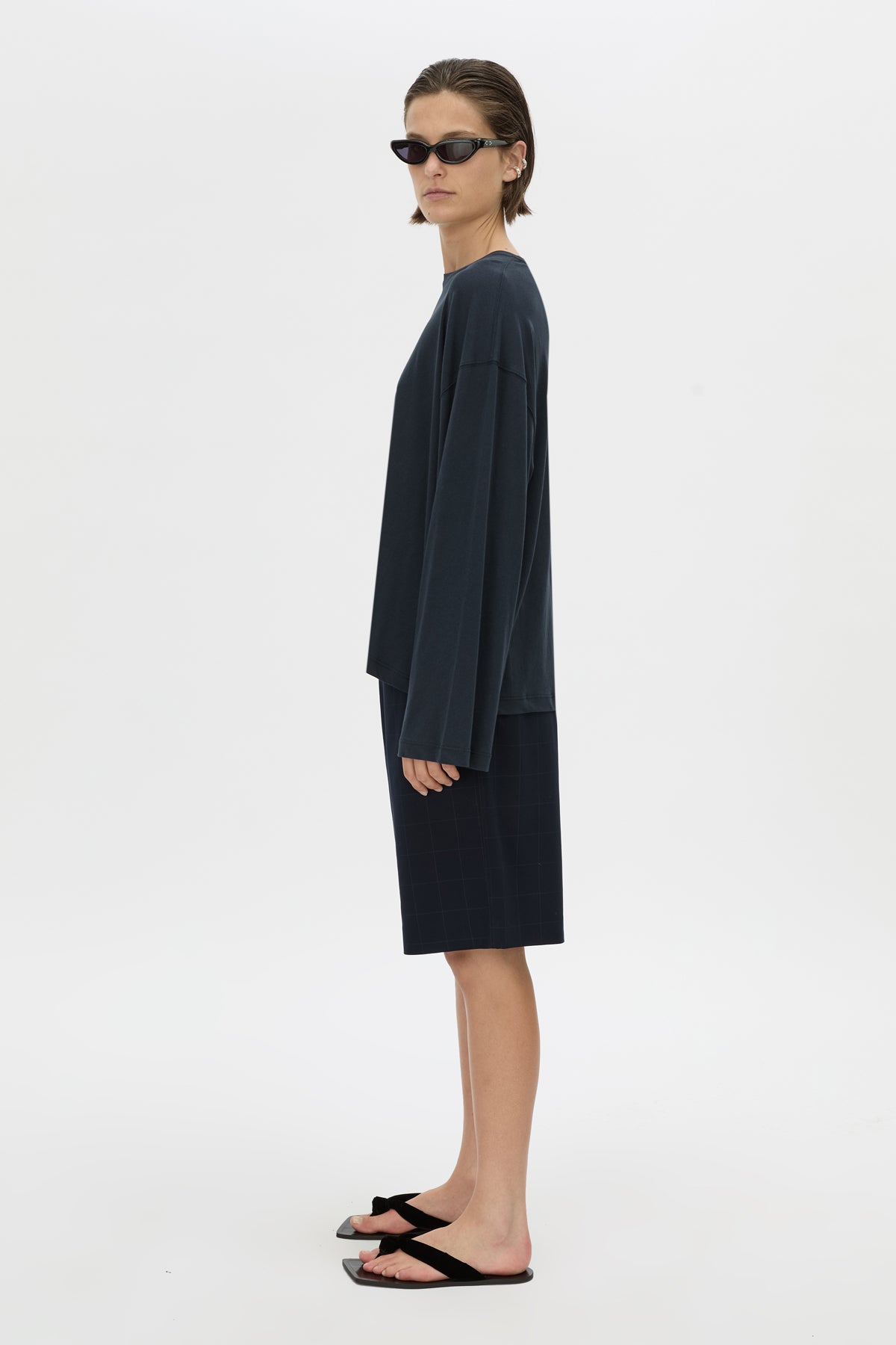 Side view CAMILLA AND MARC Dakota long sleeve top in navy.