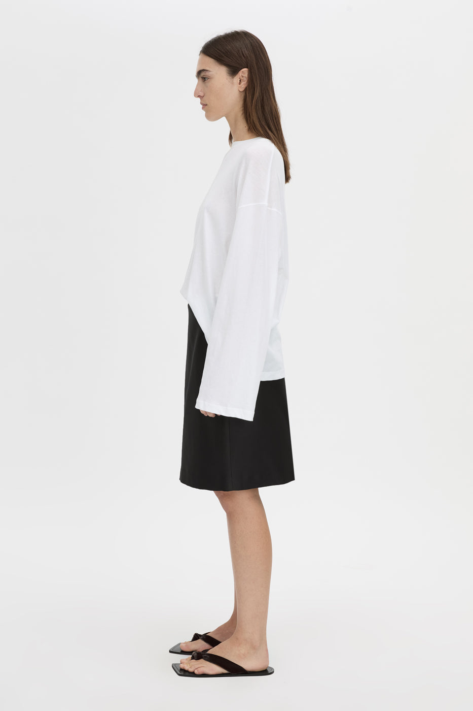 Side view CAMILLA AND MARC Dakota long sleeve top in soft white.