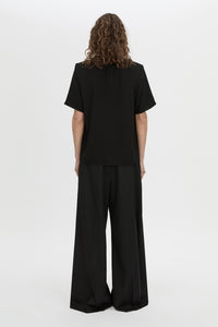 Back view CAMILLA AND MARC Darien short sleeve top in black.