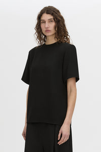 Cropped view CAMILLA AND MARC Darien short sleeve top in black.
