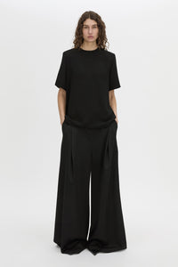 Front-styled view CAMILLA AND MARC Darien short sleeve top in black.
