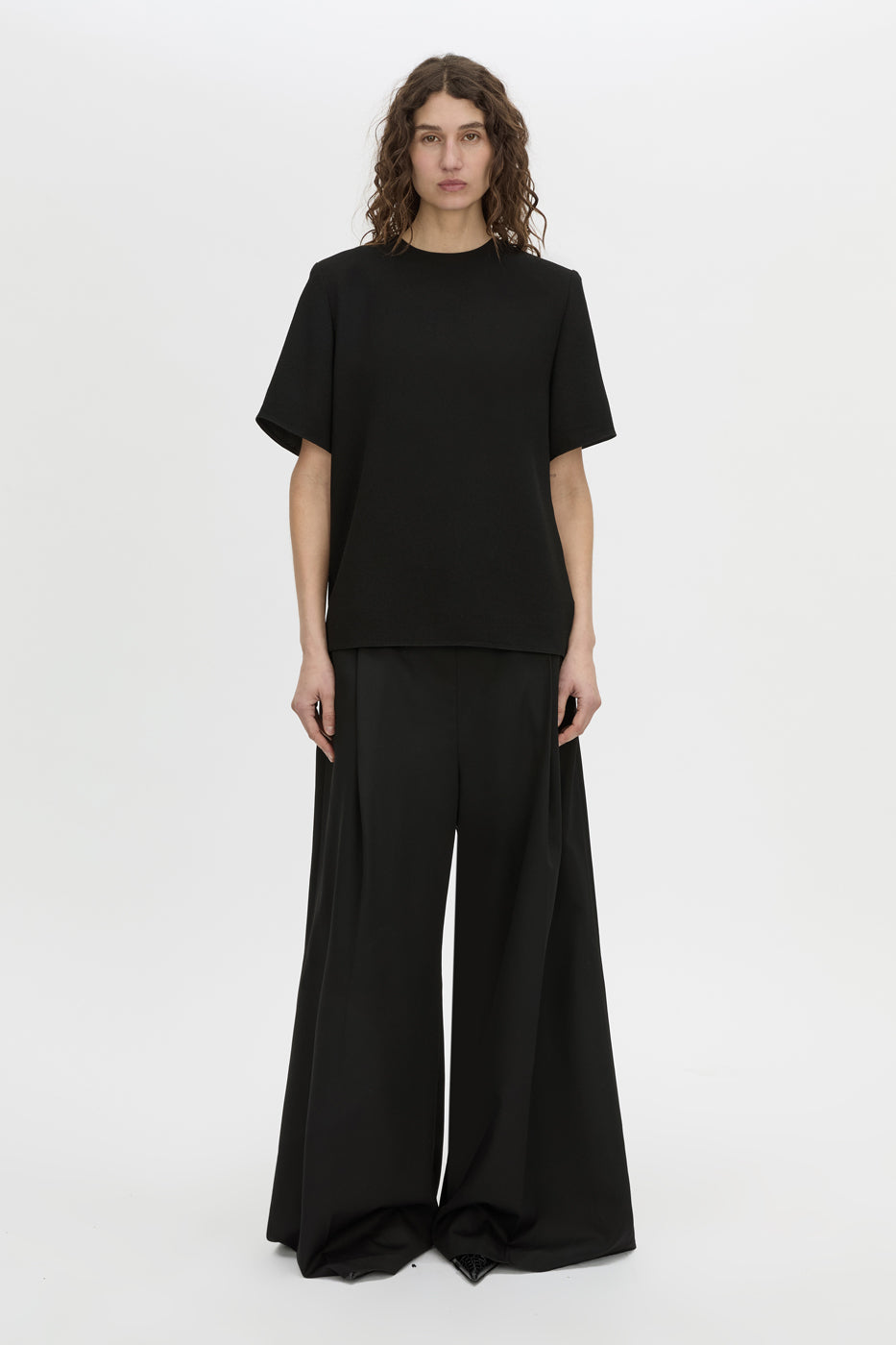 Front view CAMILLA AND MARC Darien short sleeve top in black.