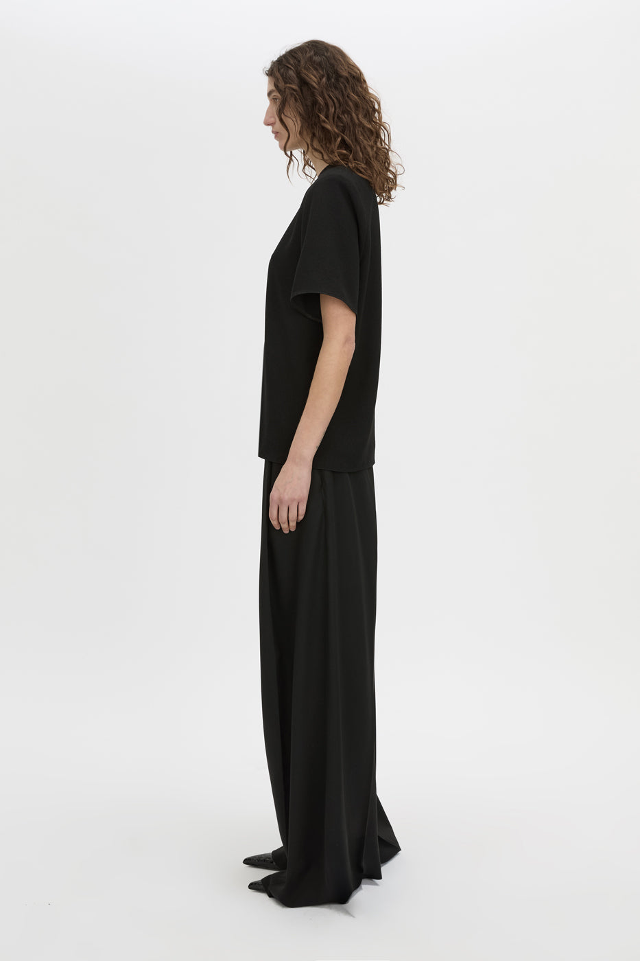 Side view CAMILLA AND MARC Darien short sleeve top in black.
