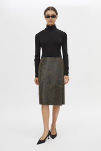 Front styled view CAMILLA AND MARC Dawn Leather Skirt in Black Brown with a wrap midi silhouette.