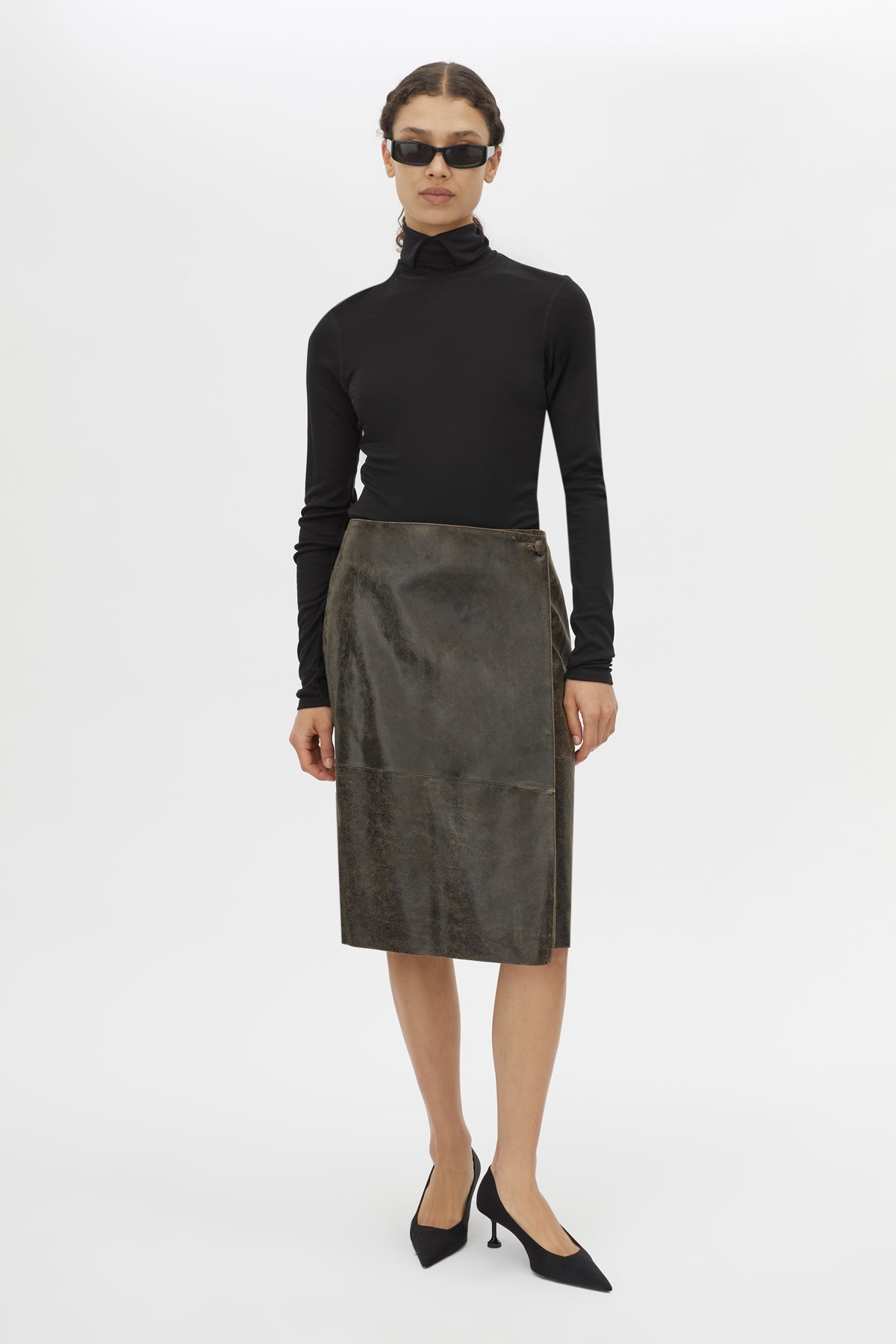 Front view CAMILLA AND MARC Dawn Leather Skirt in Black Brown with a wrap midi silhouette.