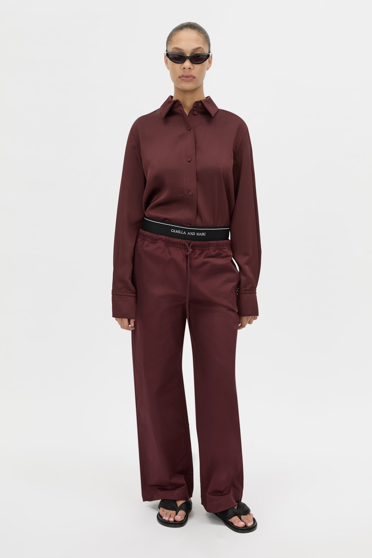 Front-styled view CAMILLA AND MARC relaxed Dia Elastic Detail Pant in burgundy.