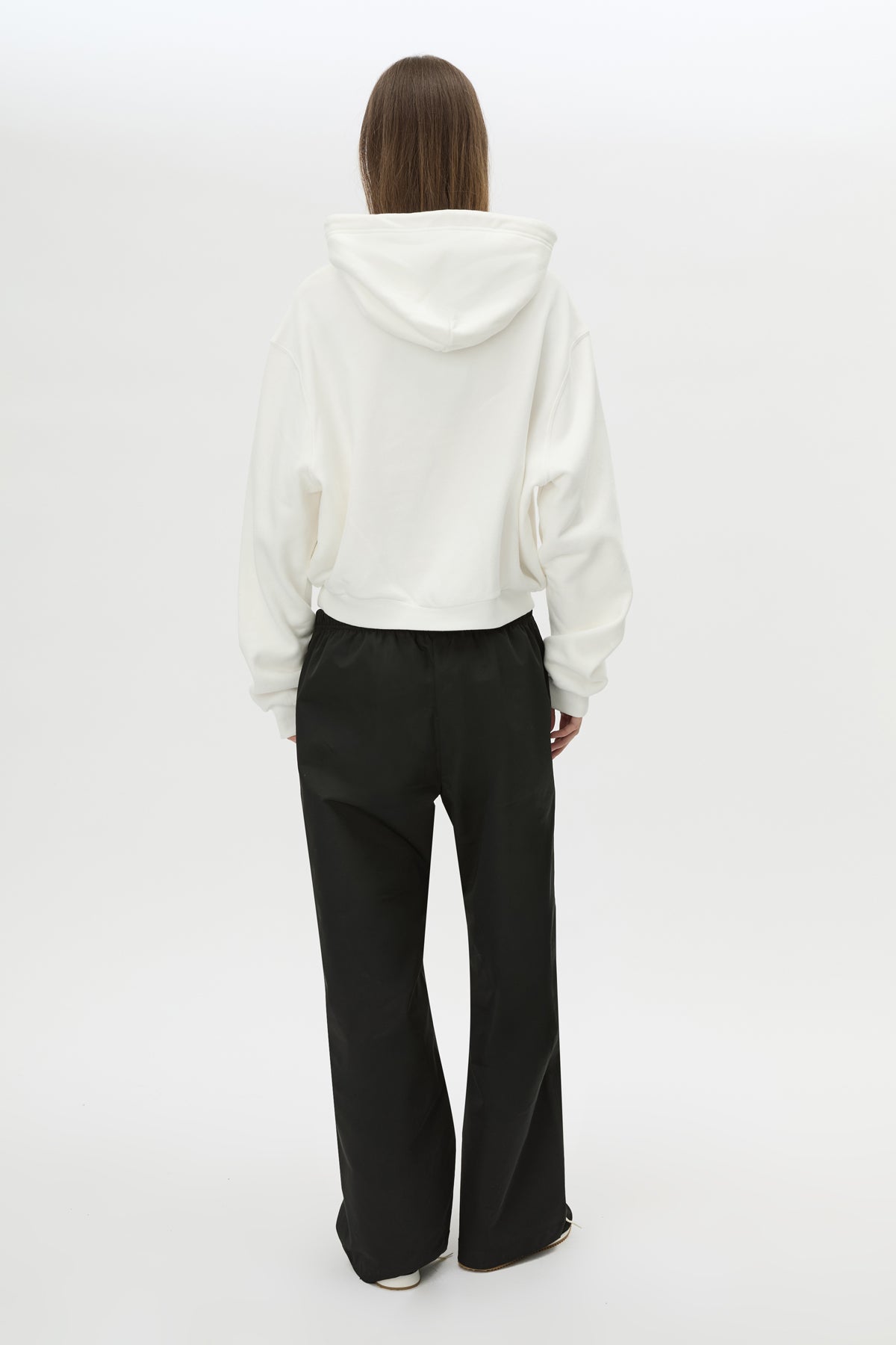 Back view CAMILLA AND MARC Dia Elastic Detail Pant in Black with logo detail.