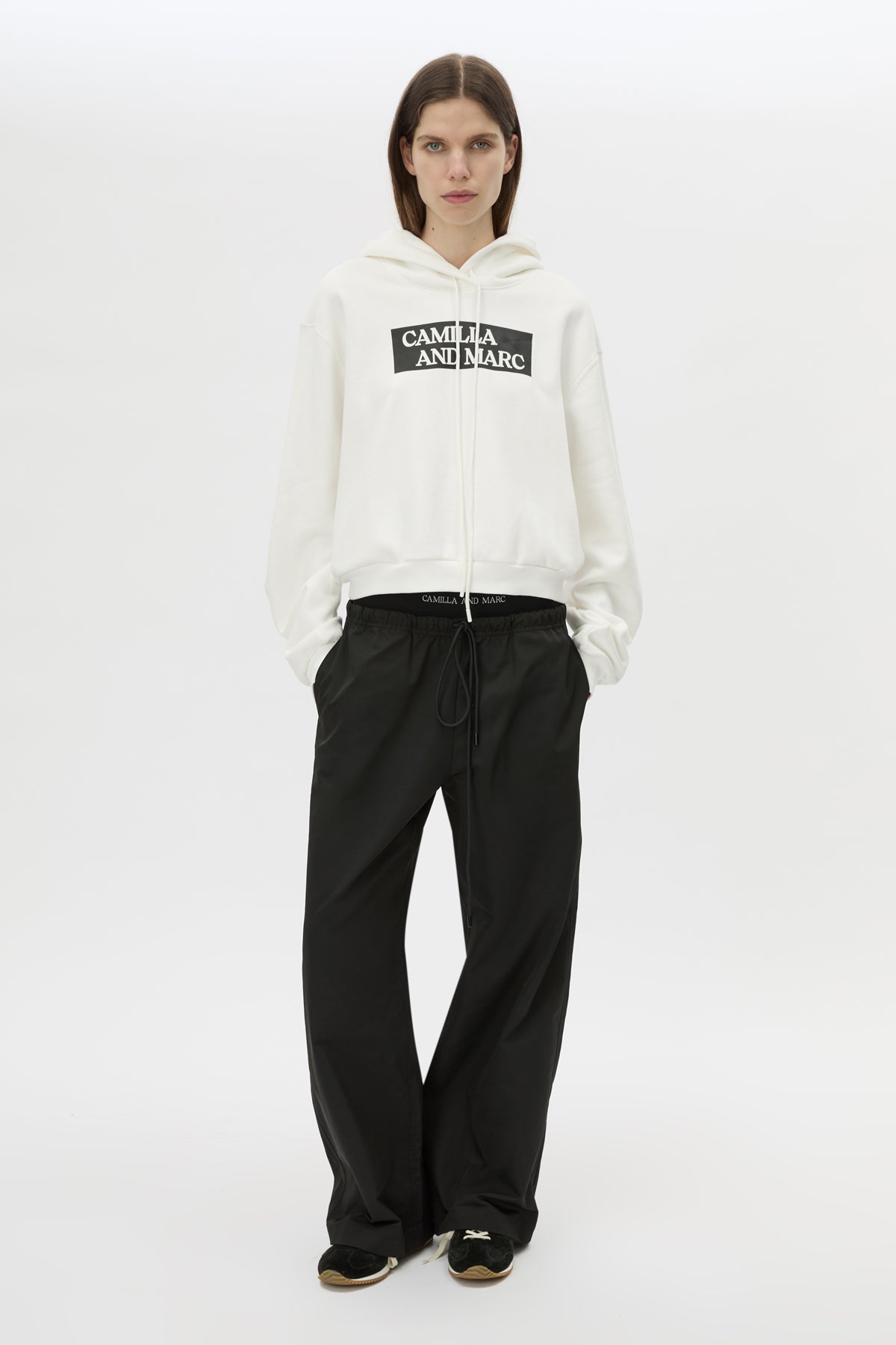 Front view CAMILLA AND MARC Dia Elastic Detail Pant in Black with logo detail.
