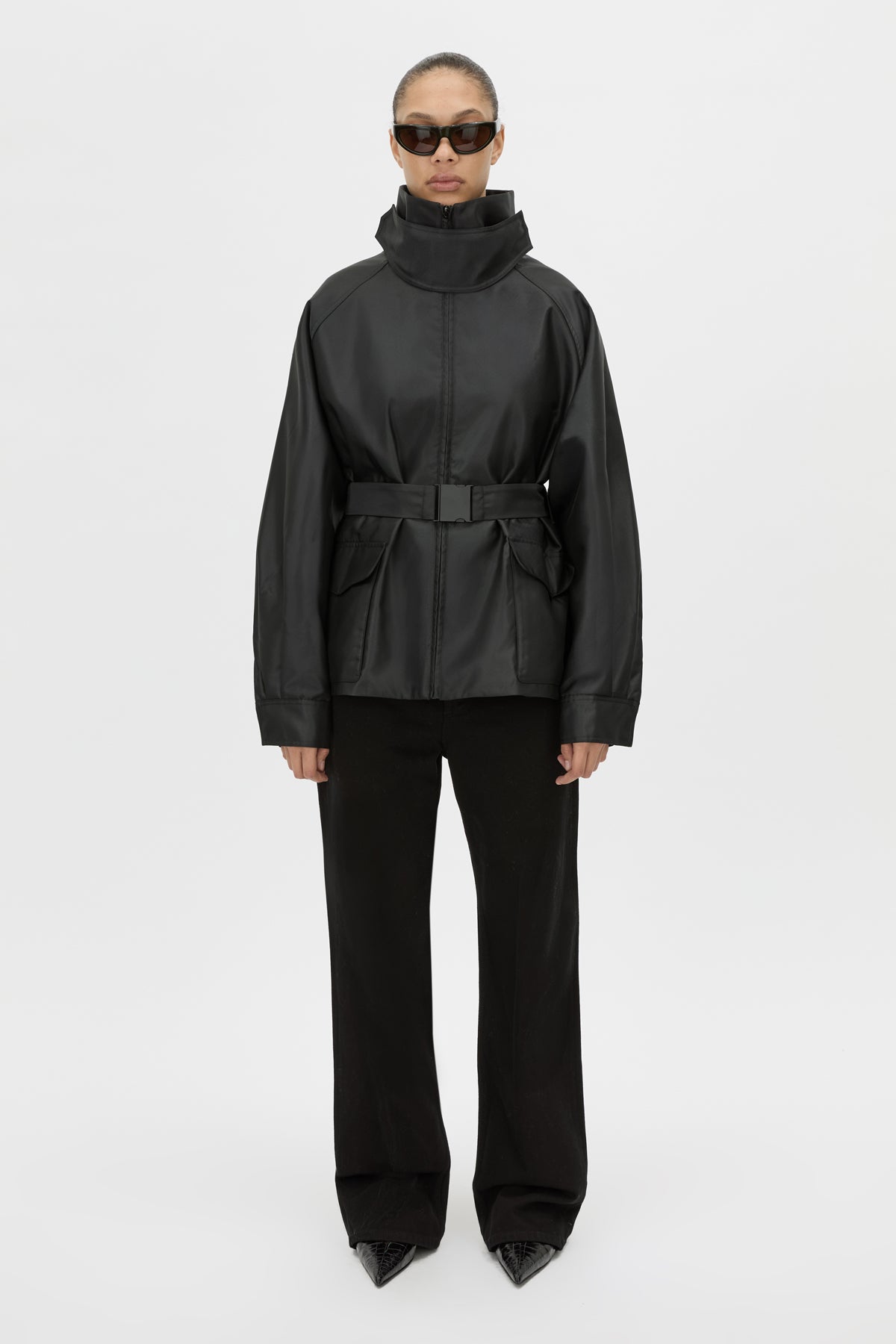 Front Styled - CAMILLA AND MARC Drea funnel neck puffer jacket in black. 