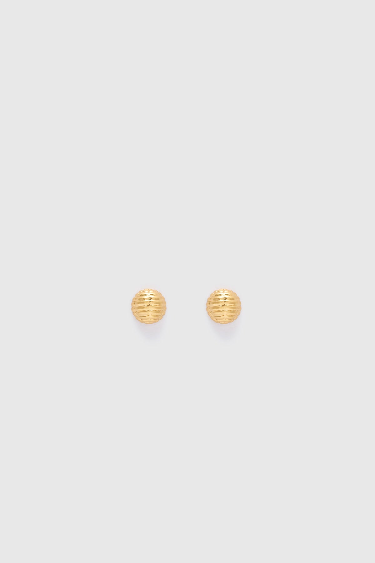 Ghost view CAMILLA AND MARC Eagan Studs in gold with petite semi‑sphere design and ruched texture.