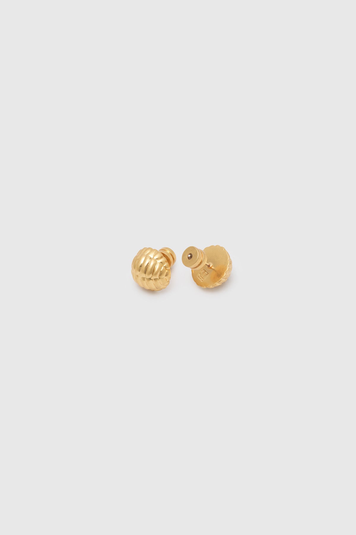 Ghost view CAMILLA AND MARC Eagan Studs in gold with petite semi‑sphere design and ruched texture.