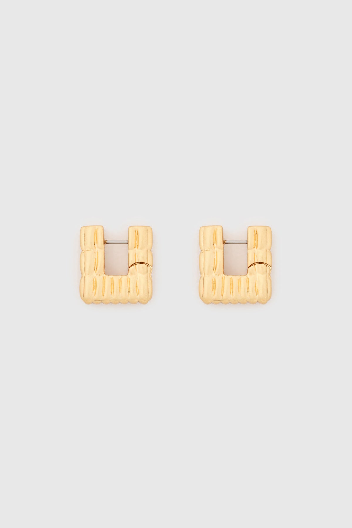 Ghost view CAMILLA AND MARC Eagan Huggies in gold with square huggie design and ruched texture.
