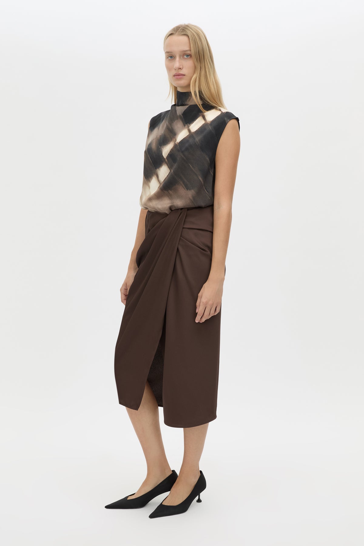 Three-quarter view CAMILLA AND MARC Elowyn Wrapped Midi Skirt in Espresso Brown with front draped detailing.