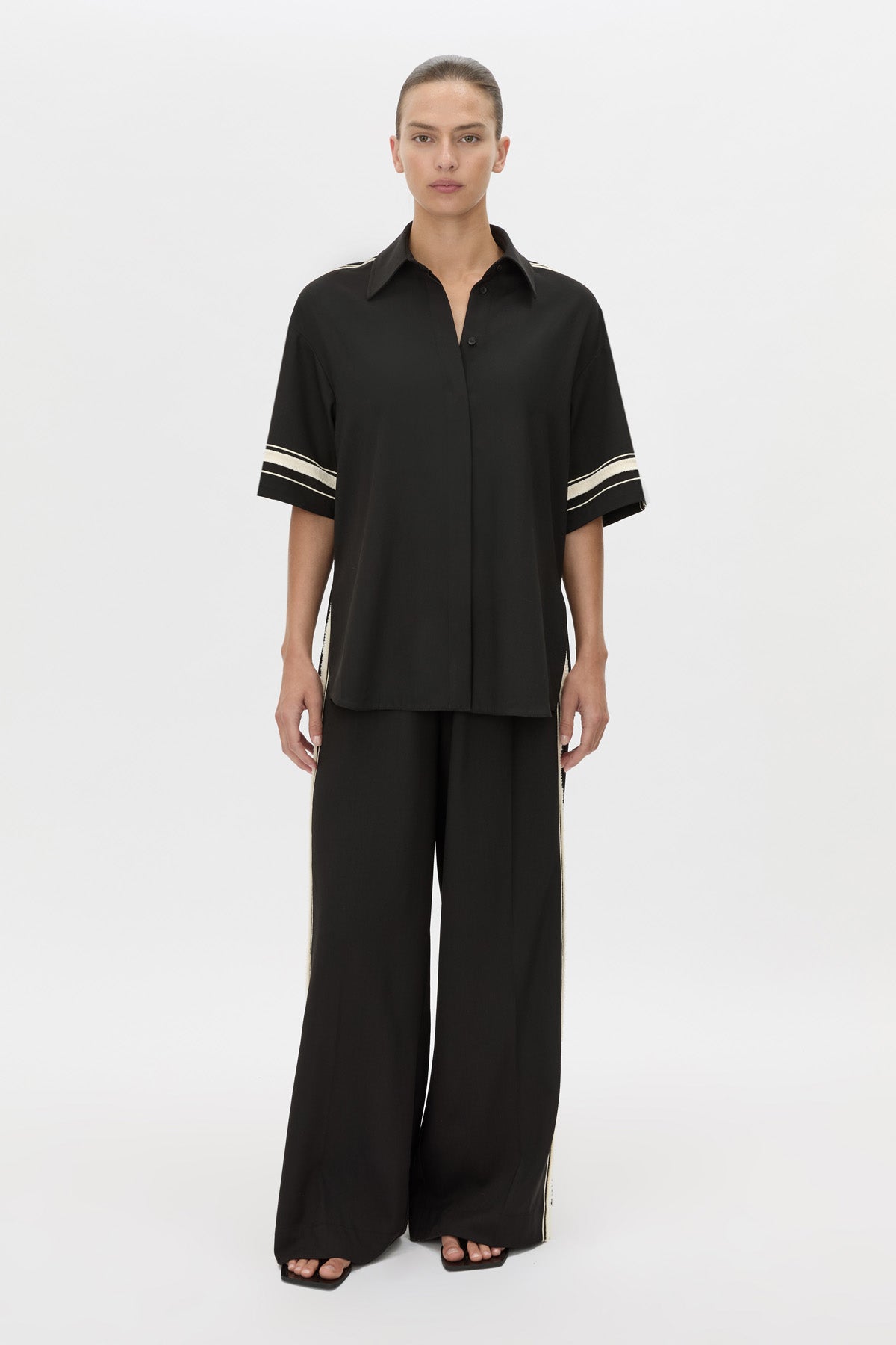 Front-styled view CAMILLA AND MARC relaxed Enna Shirt in black with embroidery detail.
