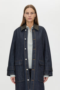 Cropped view CAMILLA AND MARC Enzo Denim Coat in Indigo Blue with a contrast leather collar and dual‑entry patch pockets.