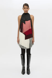 Front view CAMILLA AND MARC Evara Fringe Mini Dress with multicoloured layered satin fringe styled with the Rowan Knee Boot.