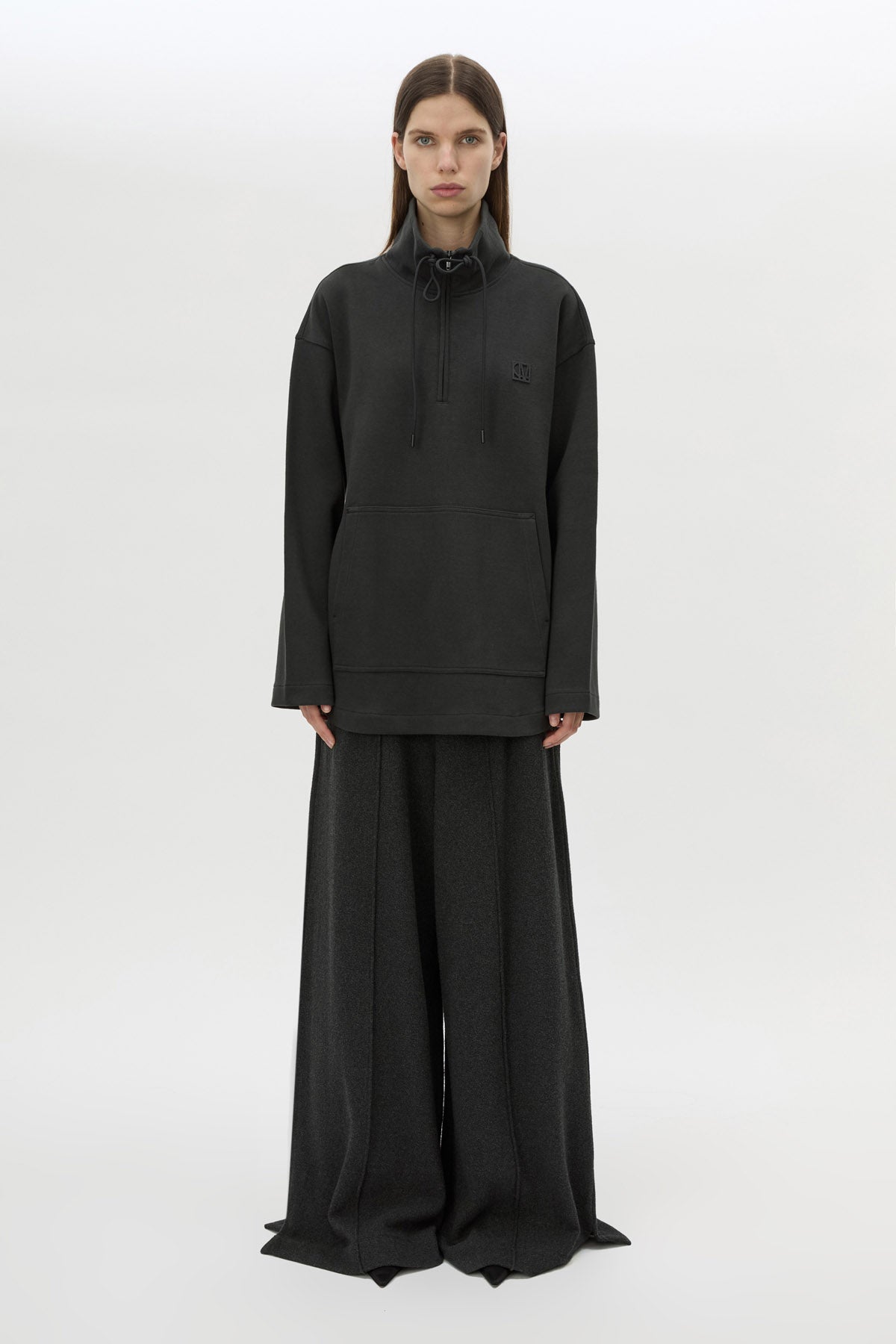 Front styled view CAMILLA AND MARC Figura Sweater in Coal Grey with cropped fleece, pullover design and quarter zip. 