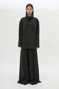 Front styled view CAMILLA AND MARC Figura Sweater in Coal Grey with cropped fleece, pullover design and quarter zip. 