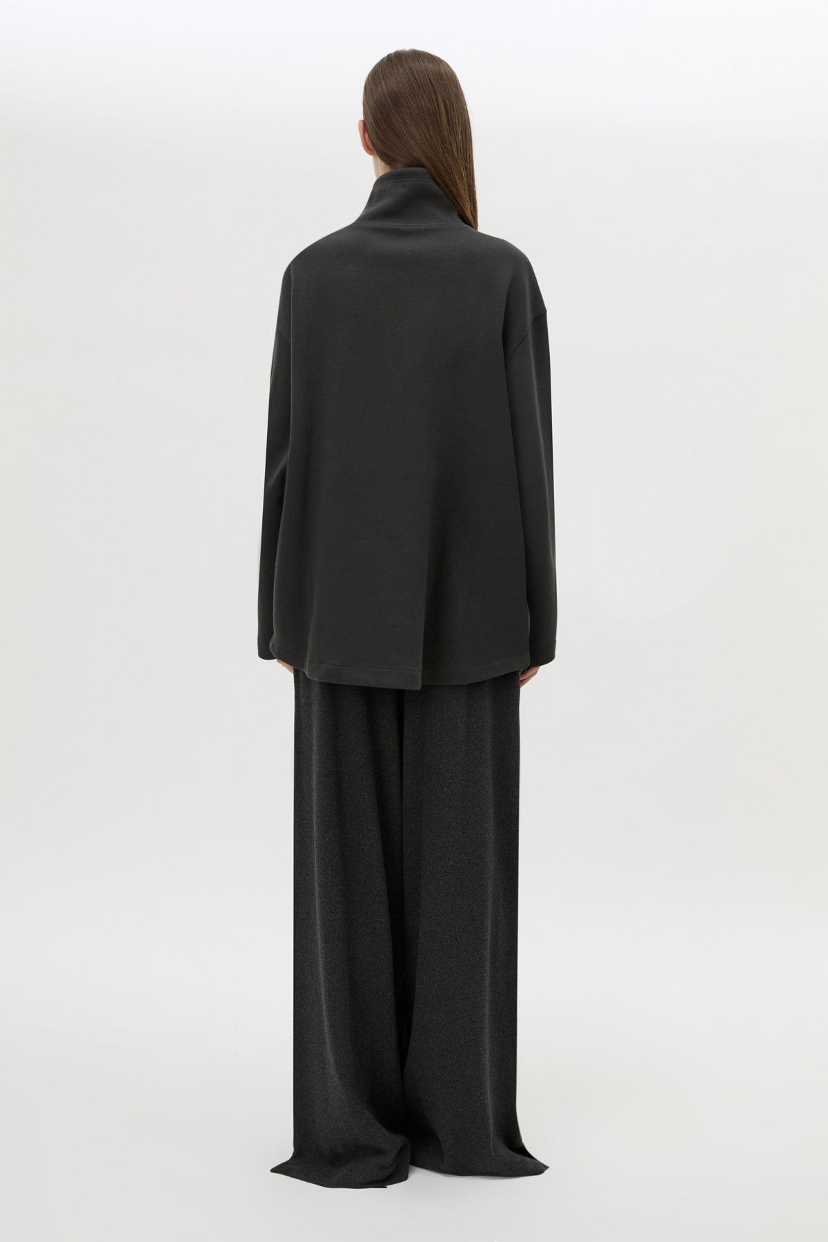 Back view CAMILLA AND MARC Figura Sweater in Coal Grey with cropped fleece, pullover design and quarter zip. 