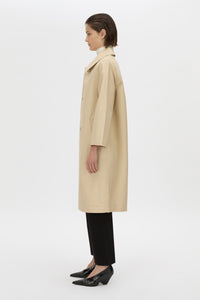 Side view CAMILLA AND MARC Florent mid length coat in latte.