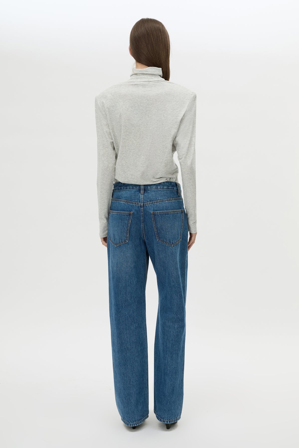 Back view CAMILLA AND MARC Florian Turtleneck Top in Grey Marle with long sleeves and removable shoulder pads.