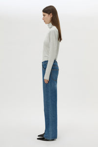 Side view CAMILLA AND MARC Florian Turtleneck Top in Grey Marle with long sleeves and removable shoulder pads.