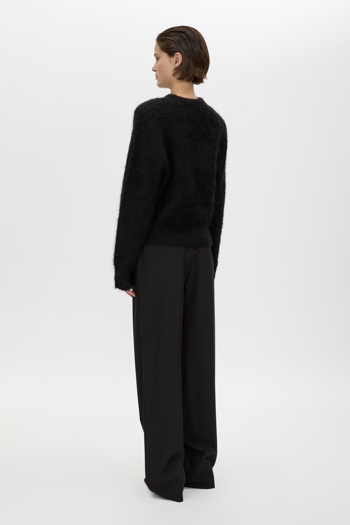 Back view CAMILLA AND MARC Ines Knit Sweater in Black with brushed knit texture and ribbed crew neckline.