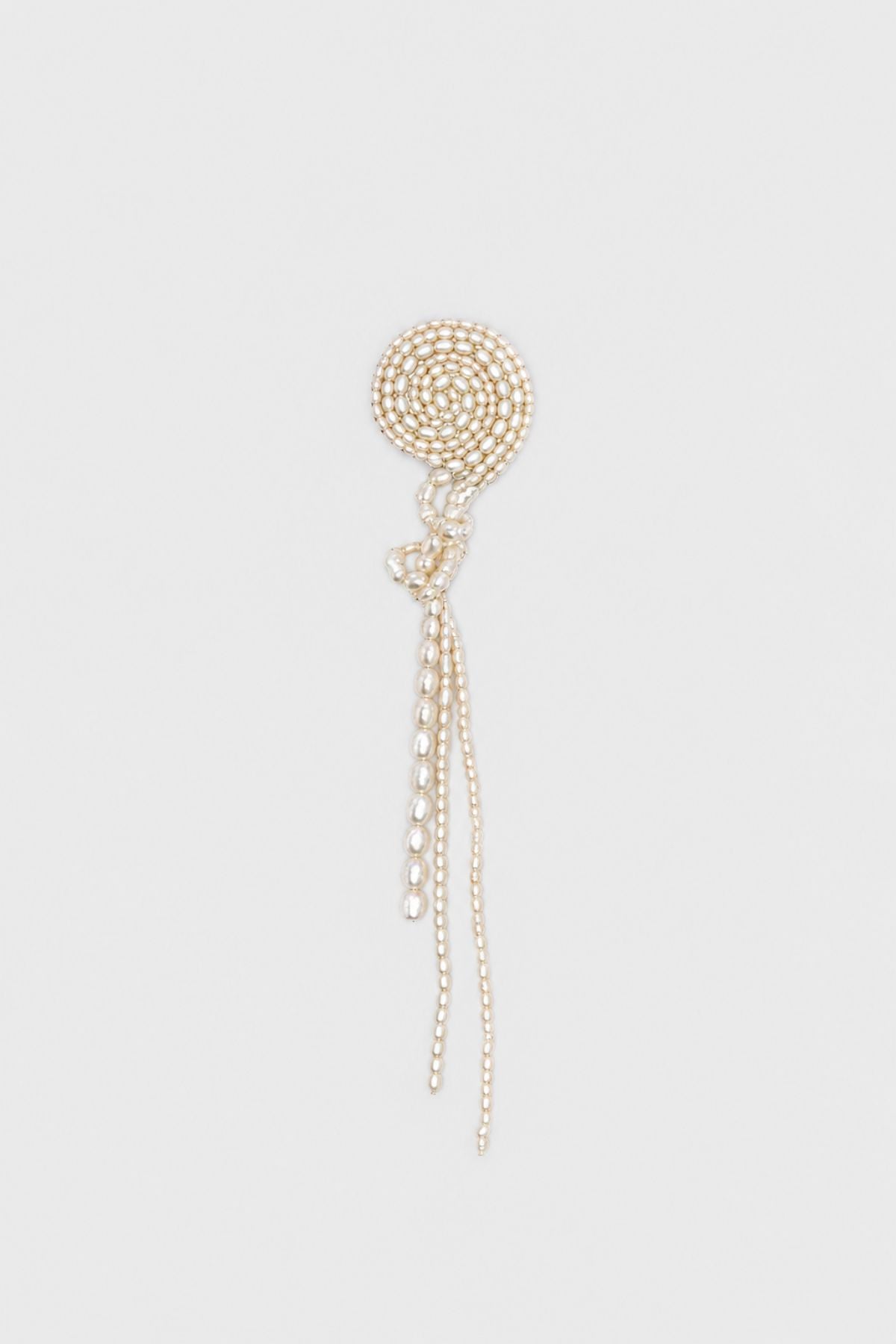 Ghost view CAMILLA AND MARC Irida Brooch in cream with spiral pearl design and hand‑knotted drop detailing.