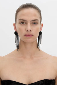 Front view CAMILLA AND MARC Irida Drop Earrings in black with glossy beaded drop design.
