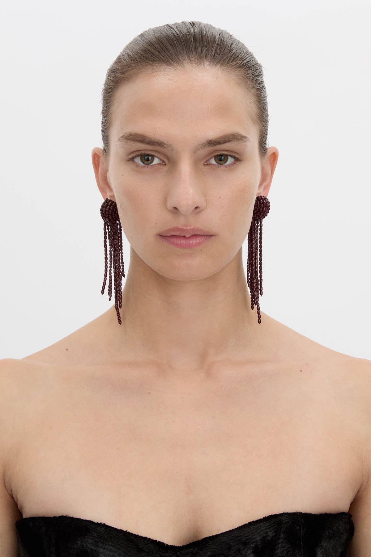 Front view CAMILLA AND MARC Irida Drop Earrings in burgundy with glossy beaded drop design.