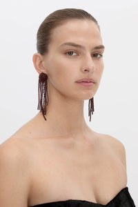 Side view CAMILLA AND MARC Irida Drop Earrings in burgundy with glossy beaded drop design.