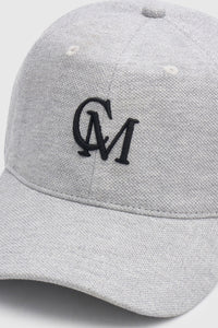 Cropped view CAMILLA AND MARC Isolde Embroidered Logo Cap in Grey Marle and black with front embroidered artwork.