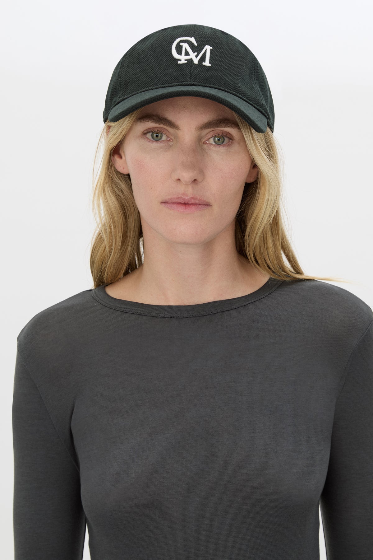 Front view CAMILLA AND MARC Isolde Embroidered Logo Cap in Black and White with front embroidered artwork.