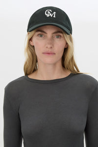 Front view CAMILLA AND MARC Isolde Embroidered Logo Cap in Black and White with front embroidered artwork.