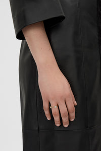 Styled view CAMILLA AND MARC Leighton Open Ring in 18k gold plating with emerald cut cubic zirconia stones.