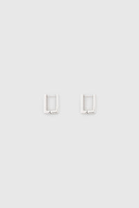 Ghost view CAMILLA AND MARC Leighton Pavé Huggies in silver with double‑row pavé cubic zirconia detailing.