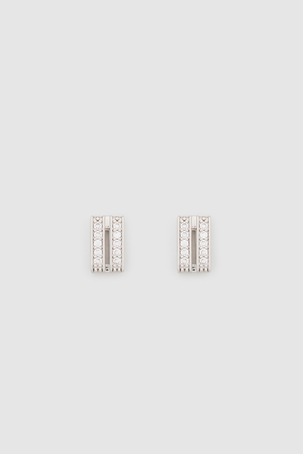 Ghost view CAMILLA AND MARC Leighton Pavé Huggies in silver with double‑row pavé cubic zirconia detailing.