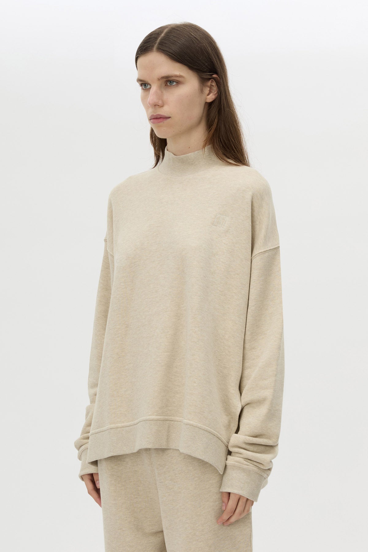 Cropped view CAMILLA AND MARC Lloyd Sweater in Cream with a ribbed turtleneck and an embroidered chest monogram.