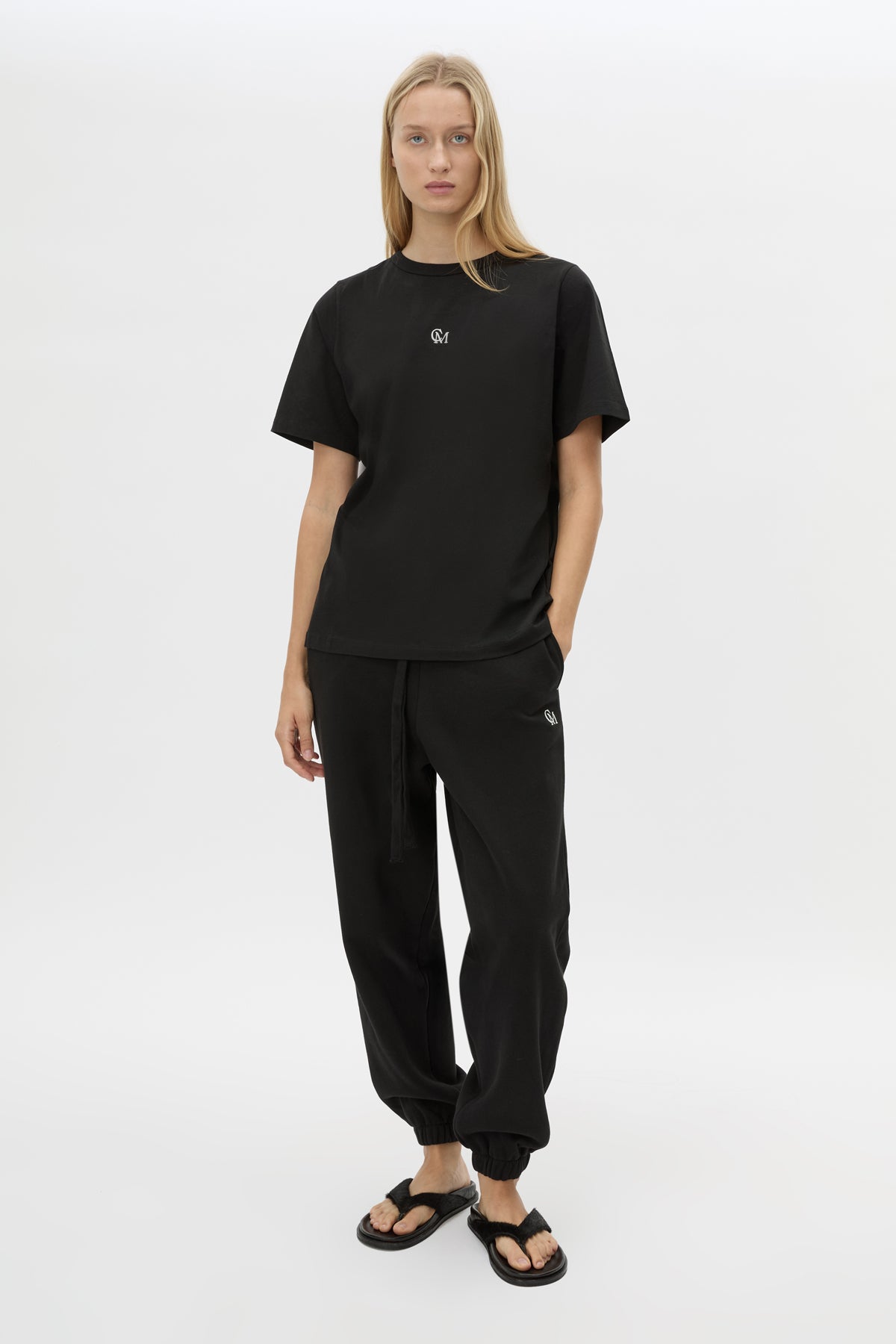 Front view CAMILLA AND MARC Lyra Logo Tee in Black with a 100% cotton fabrication.