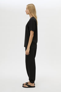 Side view CAMILLA AND MARC Lyra Logo Tee in Black with a 100% cotton fabrication.