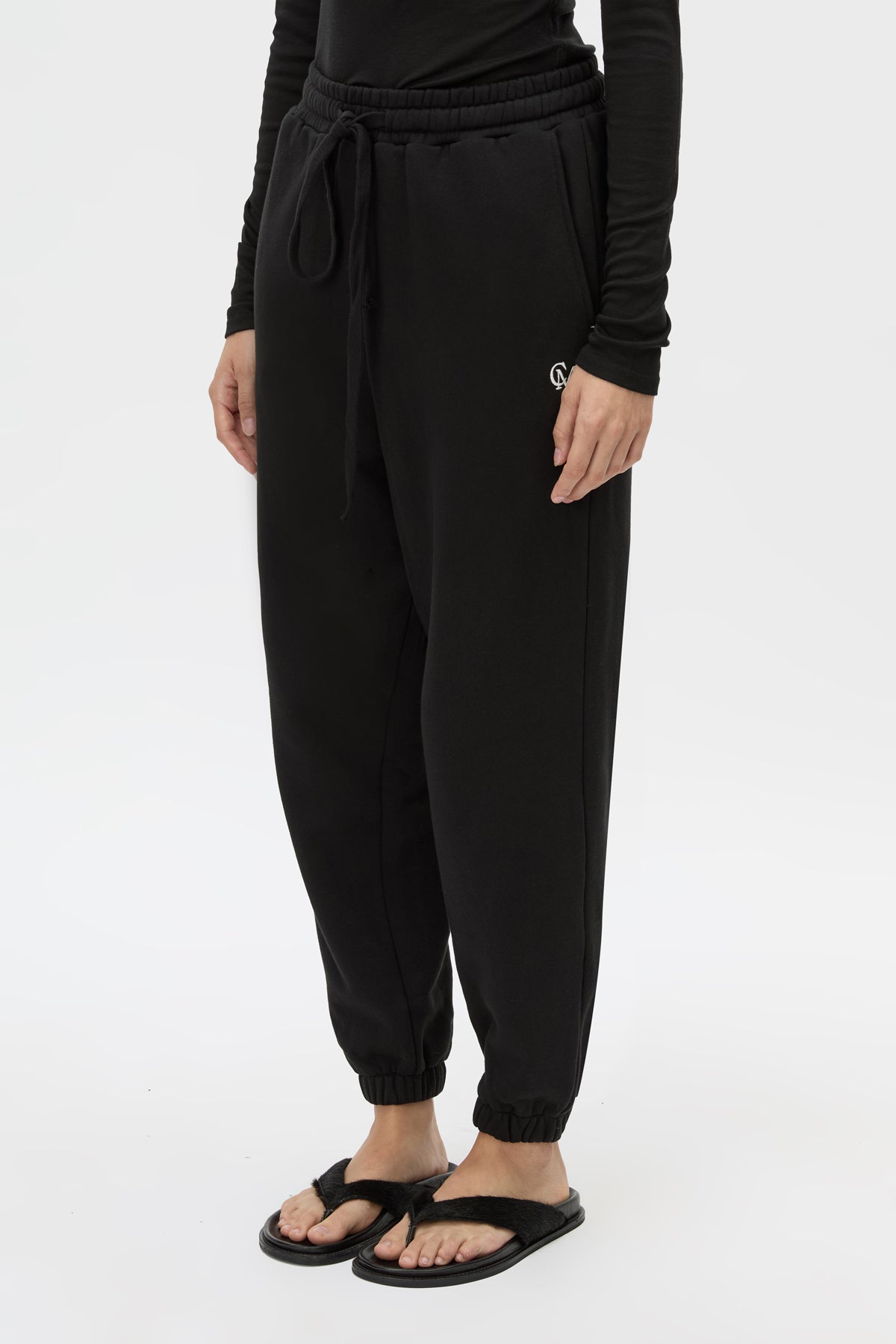 Cropped view CAMILLA AND MARC Lyra Logo Track Pant in Black and White with relaxed fit and embroidered initial detail.